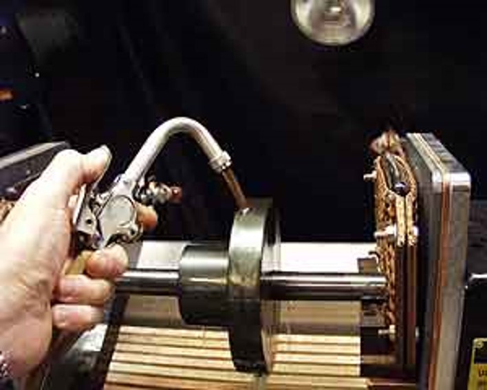 Wet fluorescent magnetic particle inpsection of automotive part